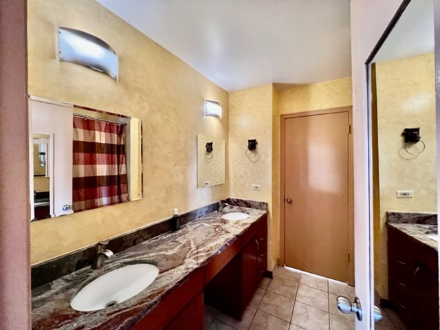 716 Sutton Circle Wheeling, IL 60090 - Photo 36 of 38 a bathroom with a granite countertop sink and a mirror