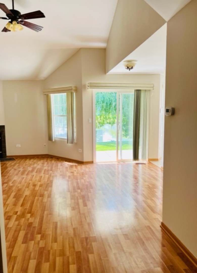 716 Sutton Circle Wheeling, IL 60090 - Photo 7 of 38 a view of an empty room with a window