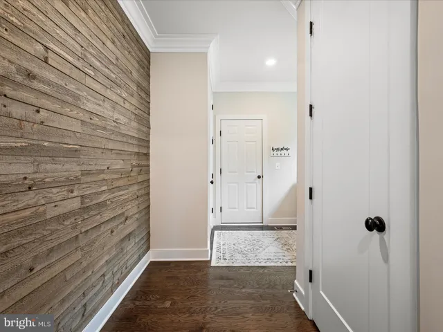 a bathroom with a toilet a sink a vanity a mirror and shower