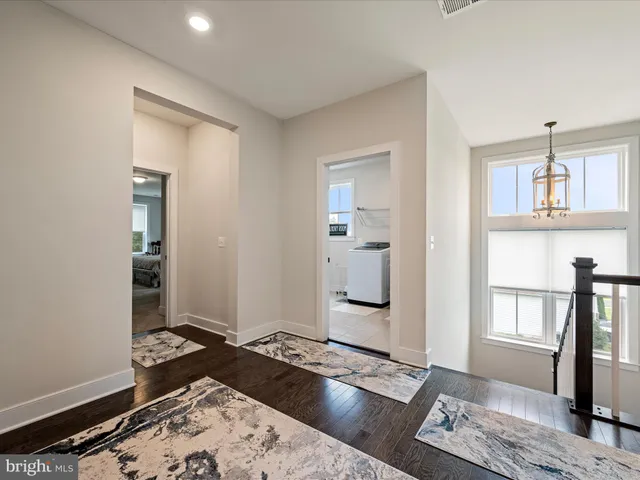 a white toilet sitting next to a small bathroom