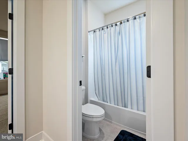 a bedroom with furniture and a flat screen tv