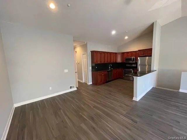a view of kitchen and wooden floor