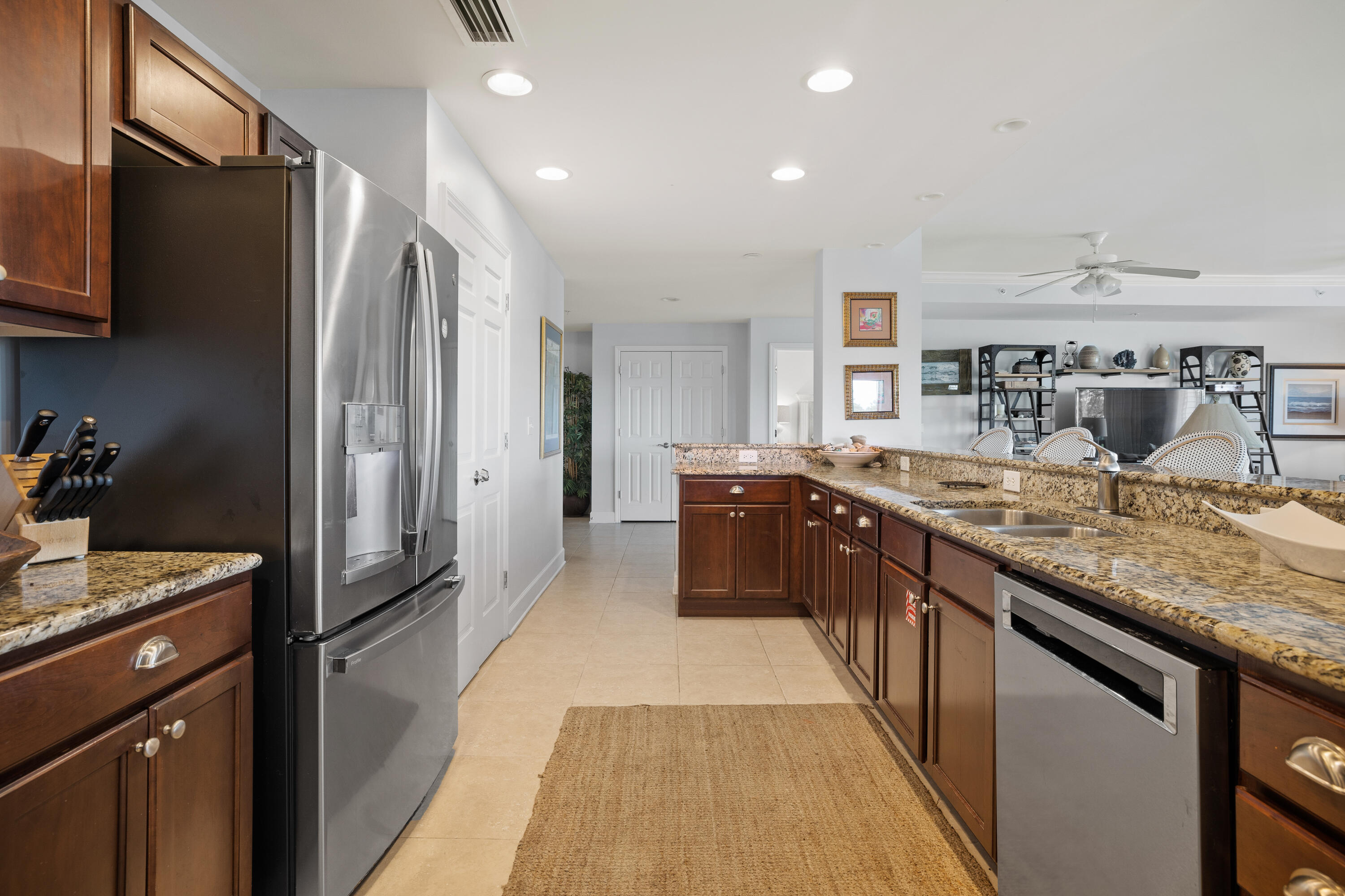 1732 West County Highway 30A, Unit 403R Santa Rosa Beach, FL 32459 - Photo 12 of 57 a kitchen with stainless steel appliances granite countertop a sink stove and refrigerator