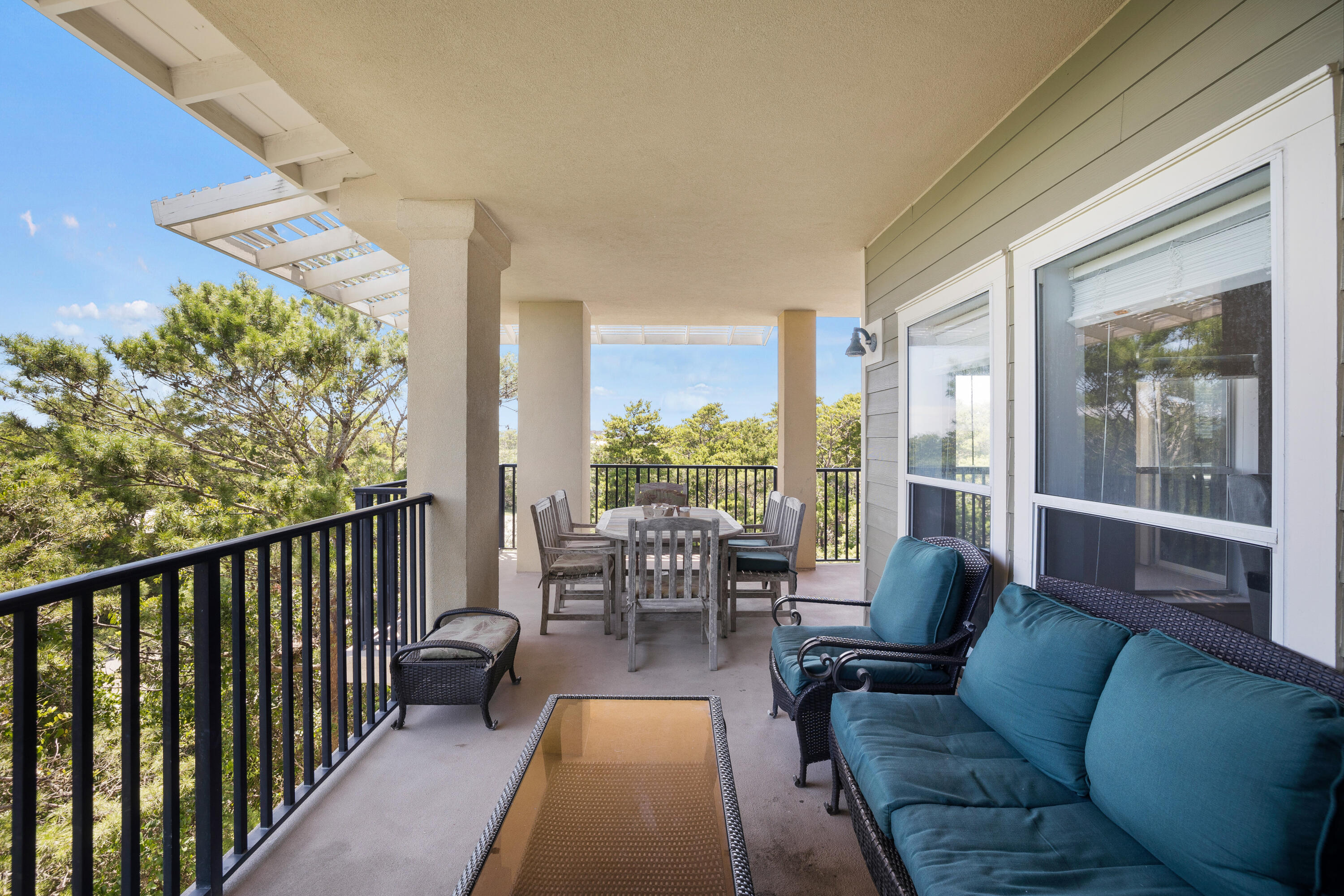 1732 West County Highway 30A, Unit 403R Santa Rosa Beach, FL 32459 - Photo 15 of 57 a balcony with furniture and a potted plant