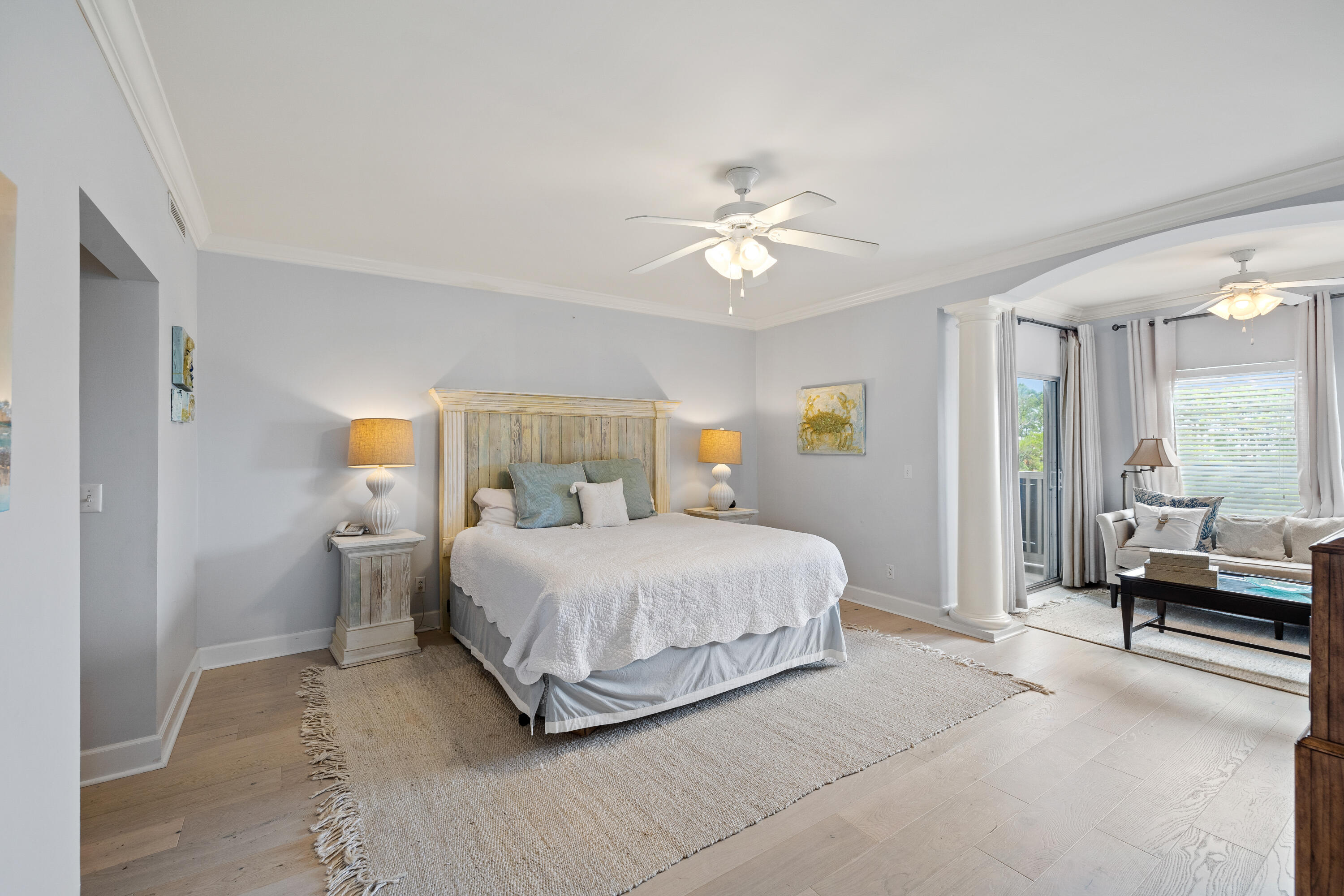 1732 West County Highway 30A, Unit 403R Santa Rosa Beach, FL 32459 - Photo 18 of 57 a bedroom with a large bed and a chandelier