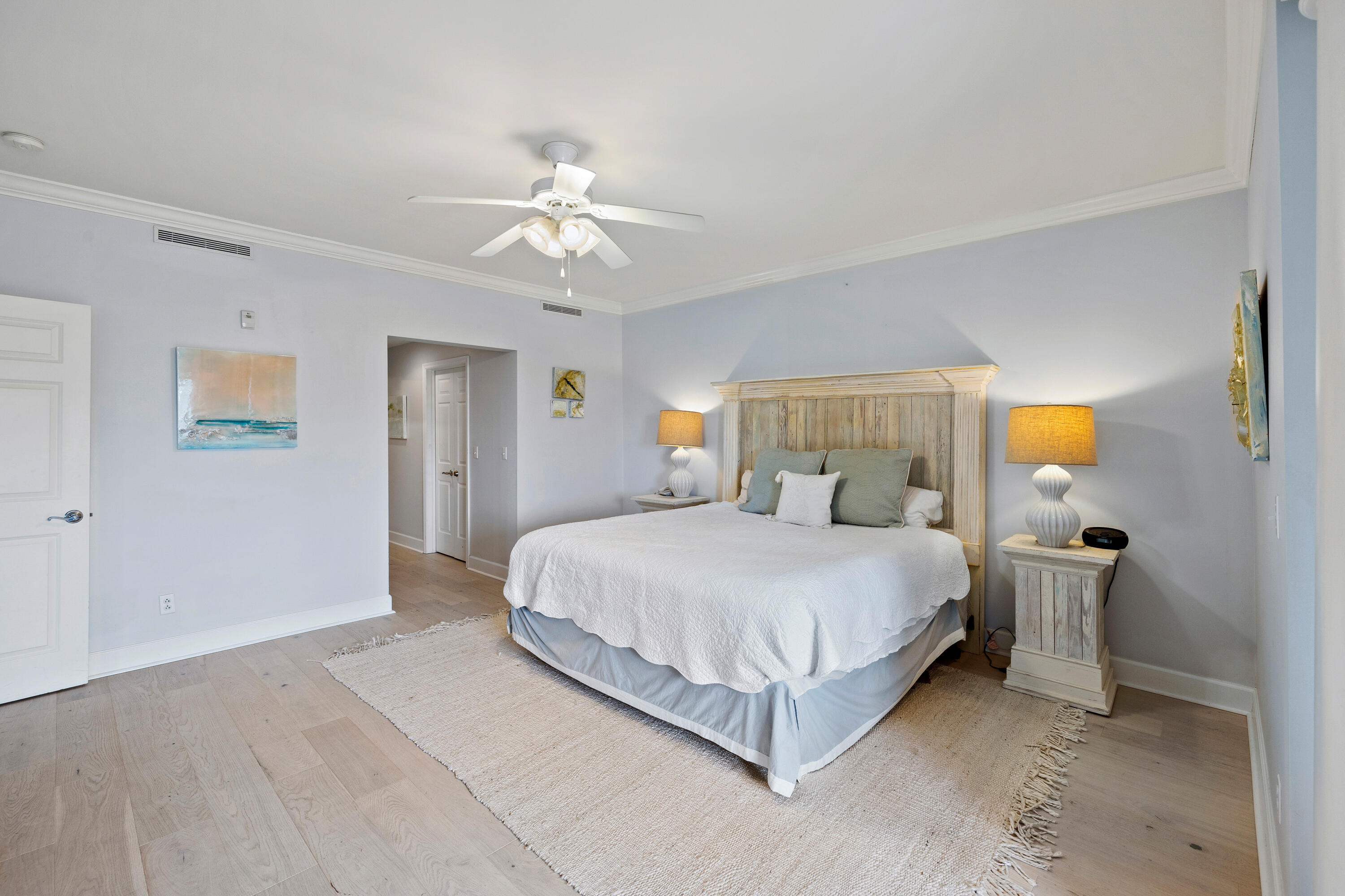 1732 West County Highway 30A, Unit 403R Santa Rosa Beach, FL 32459 - Photo 20 of 57 a bedroom with a bed and a chandelier