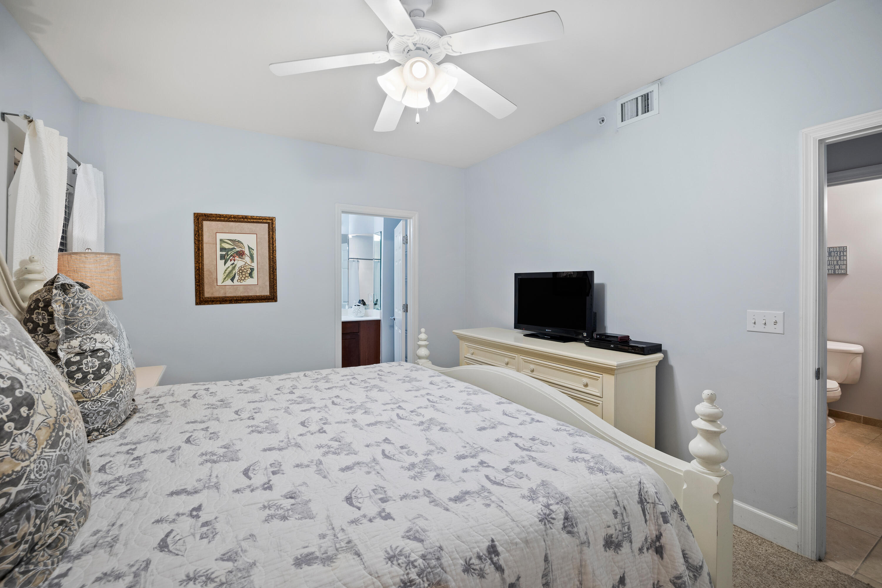 1732 West County Highway 30A, Unit 403R Santa Rosa Beach, FL 32459 - Photo 30 of 57 a bedroom with a bed and a flat screen tv