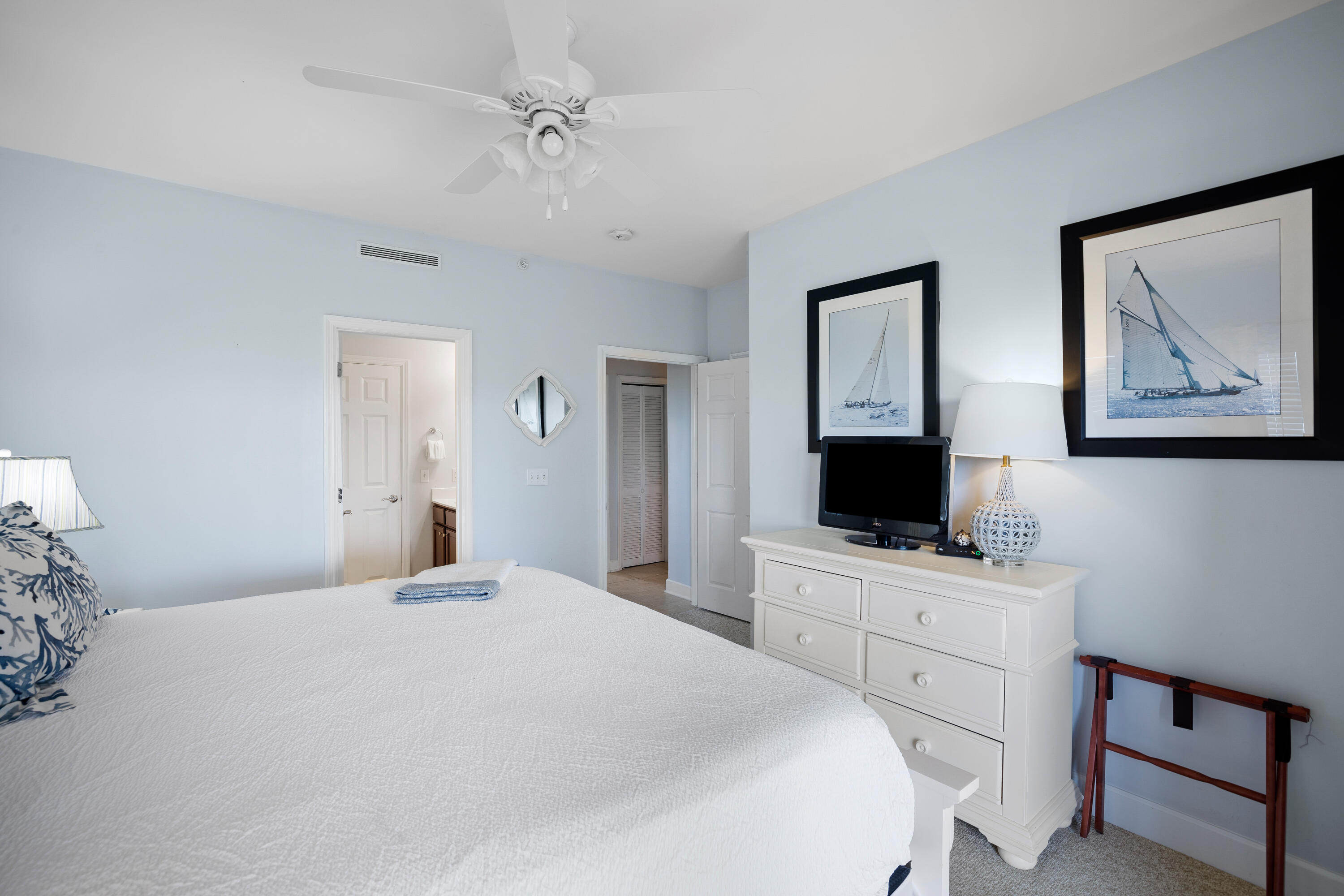 1732 West County Highway 30A, Unit 403R Santa Rosa Beach, FL 32459 - Photo 32 of 57 a bedroom with a large bed and a flat tv screen on dresser