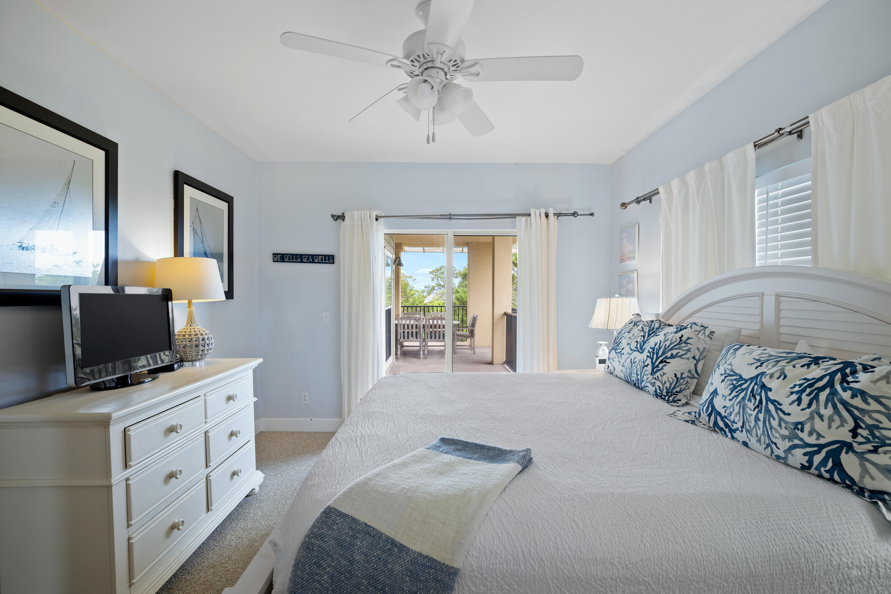 1732 West County Highway 30A, Unit 403R Santa Rosa Beach, FL 32459 - Photo 33 of 57 a bedroom with a bed and a flat tv screen on dresser
