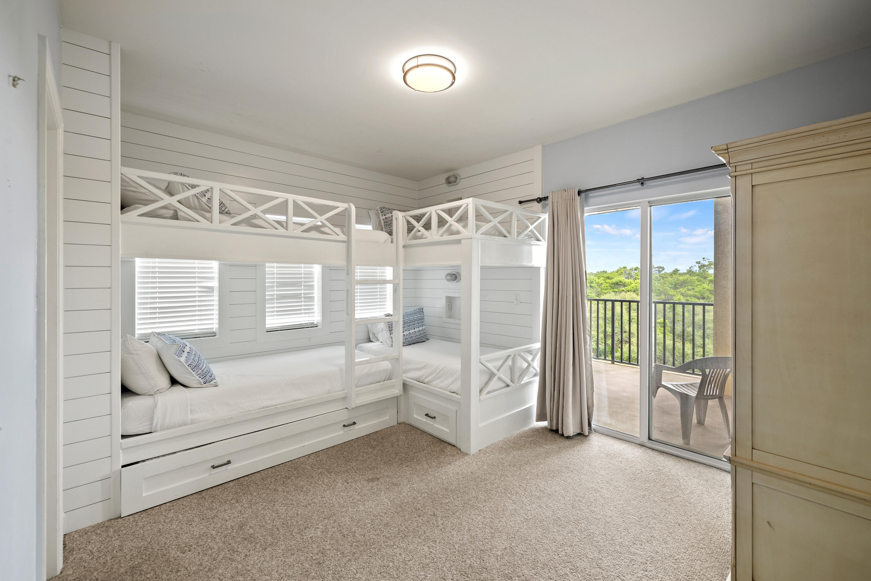 1732 West County Highway 30A, Unit 403R Santa Rosa Beach, FL 32459 - Photo 35 of 57 a spacious bedroom with a bed and a chandelier