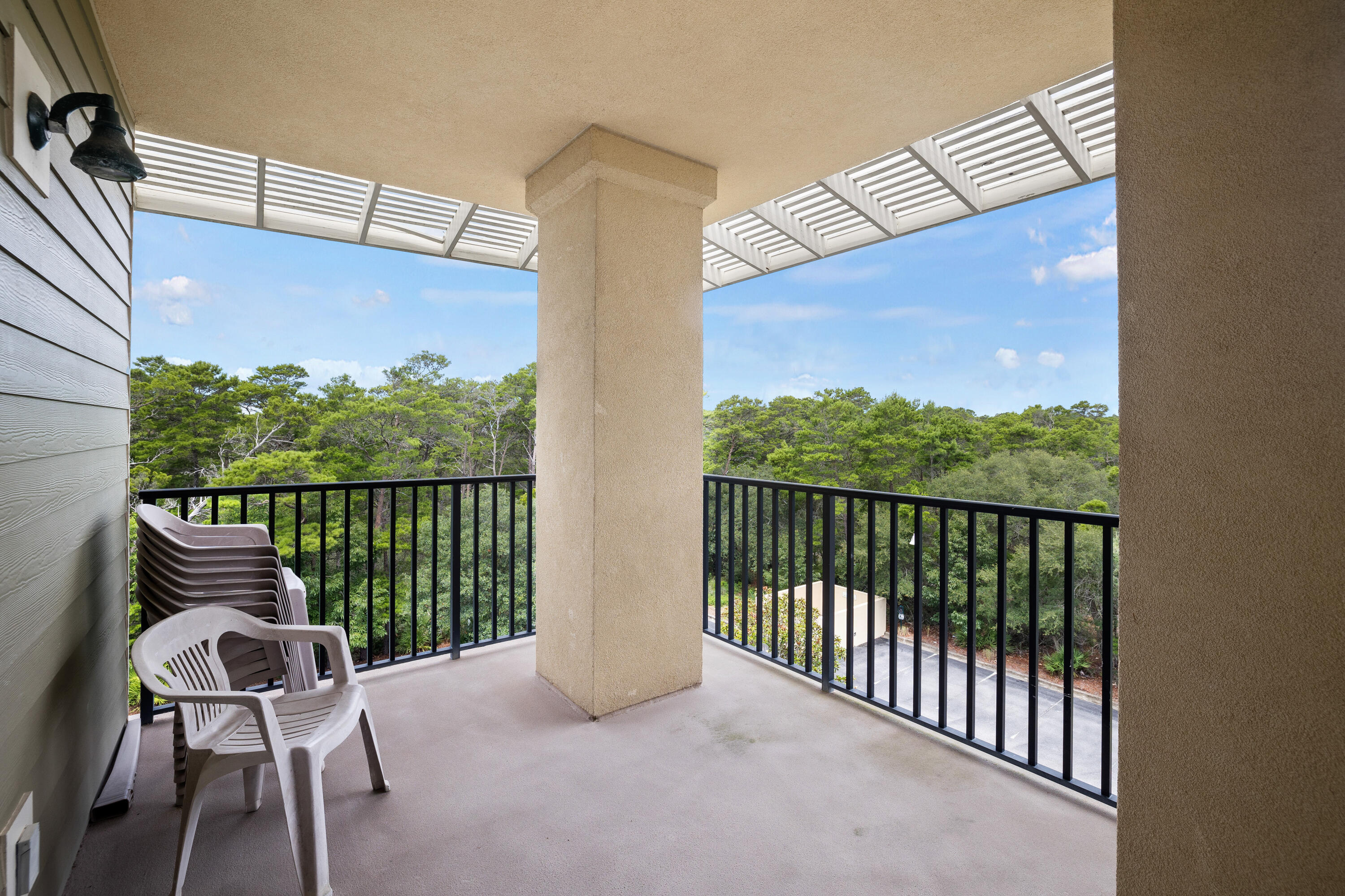 1732 West County Highway 30A, Unit 403R Santa Rosa Beach, FL 32459 - Photo 38 of 57 a balcony with table and chairs