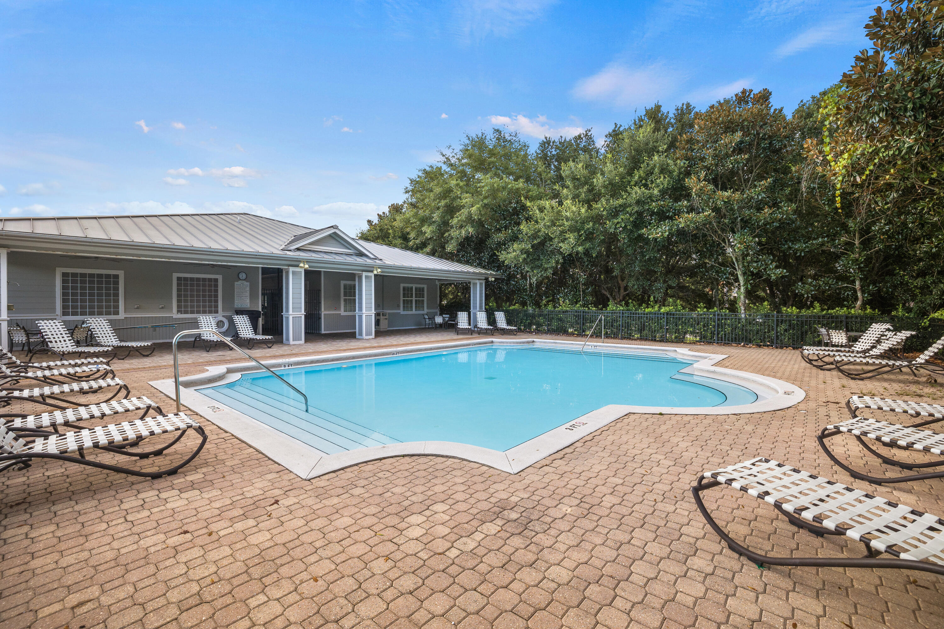 1732 West County Highway 30A, Unit 403R Santa Rosa Beach, FL 32459 - Photo 50 of 57 a view of a house with swimming pool and porch
