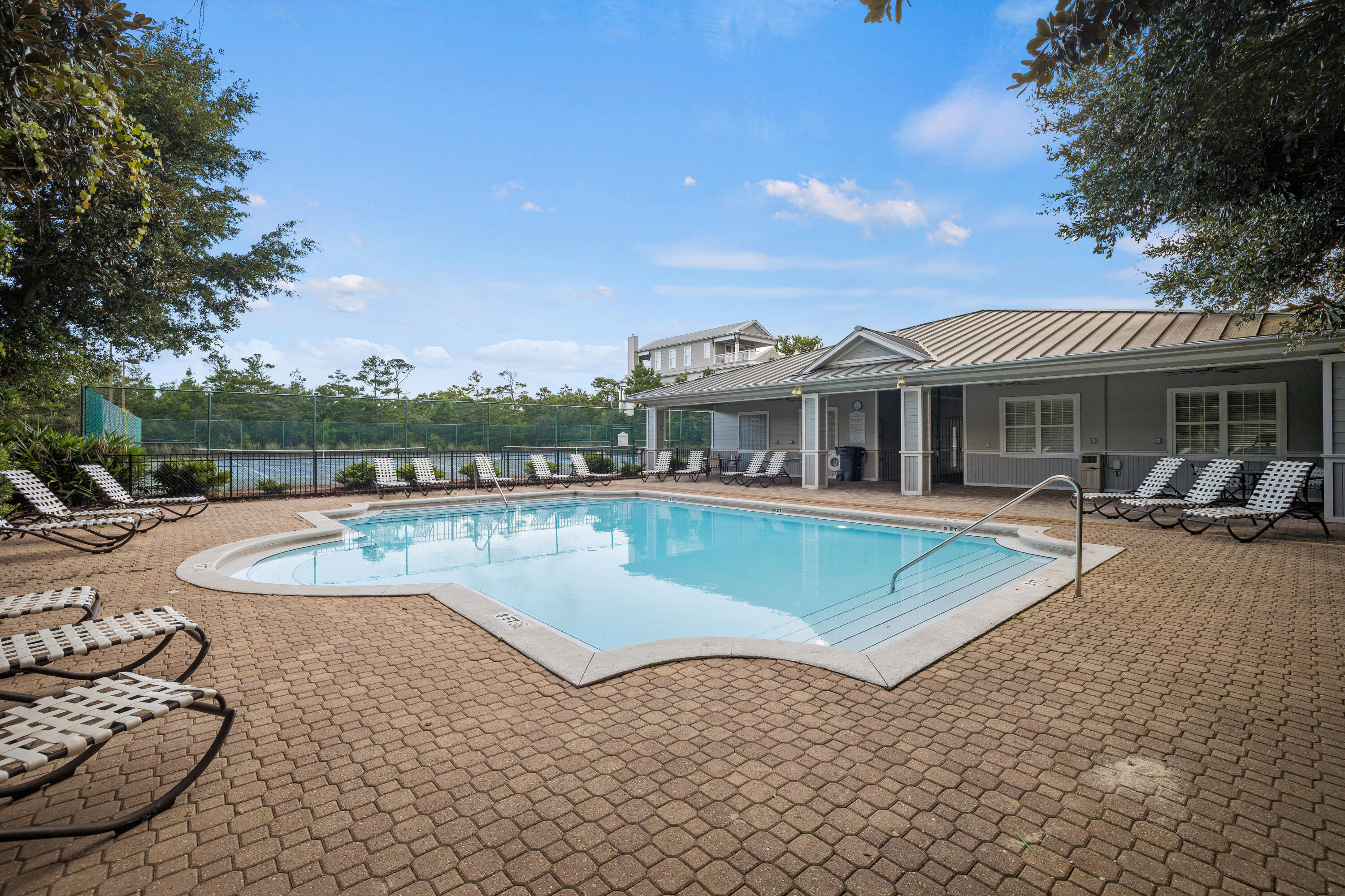 1732 West County Highway 30A, Unit 403R Santa Rosa Beach, FL 32459 - Photo 52 of 57 a view of a house with swimming pool and sitting area
