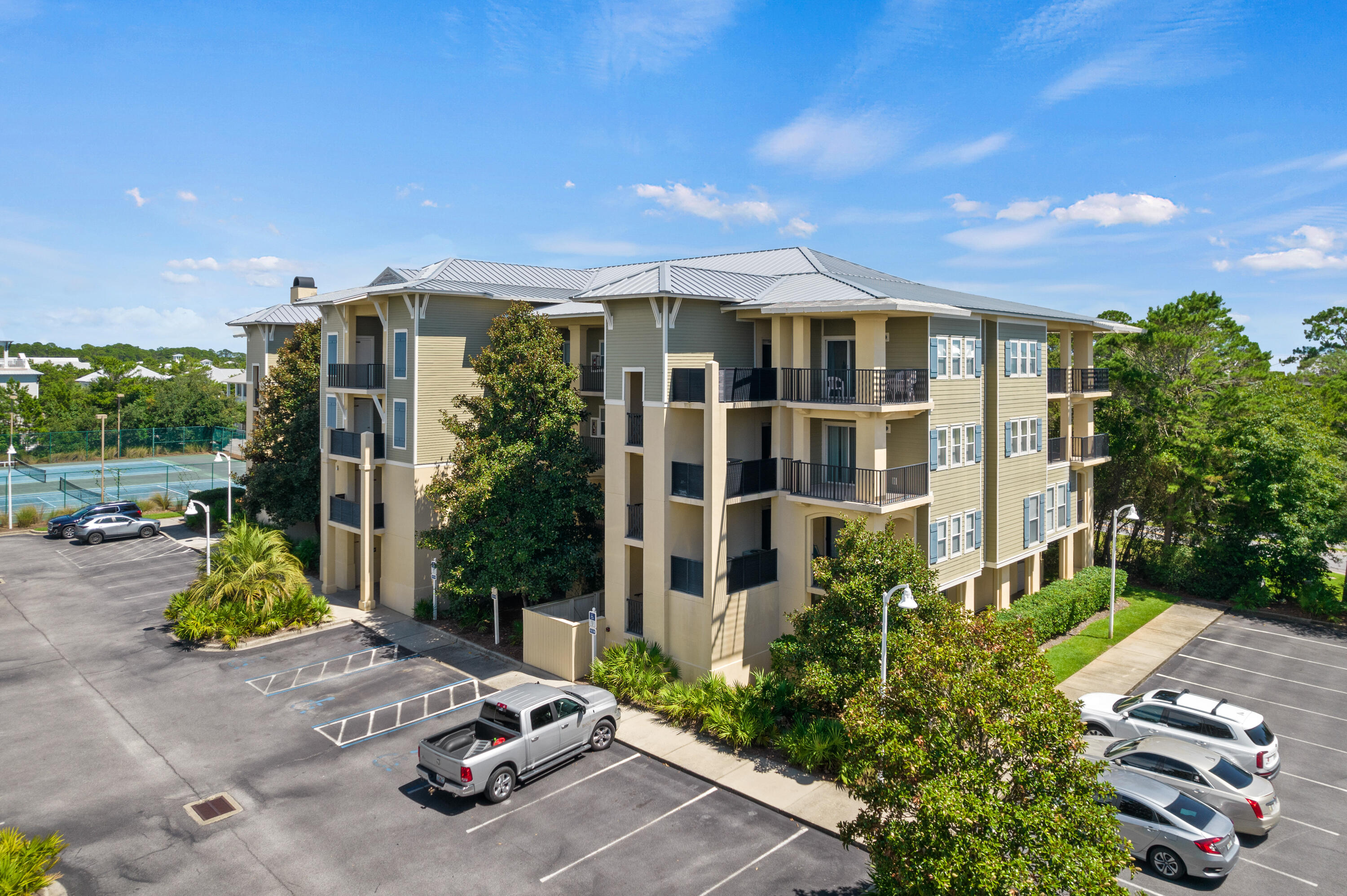 1732 West County Highway 30A, Unit 403R Santa Rosa Beach, FL 32459 - Photo 55 of 57 a view of a patio with table and chairs and potted plants