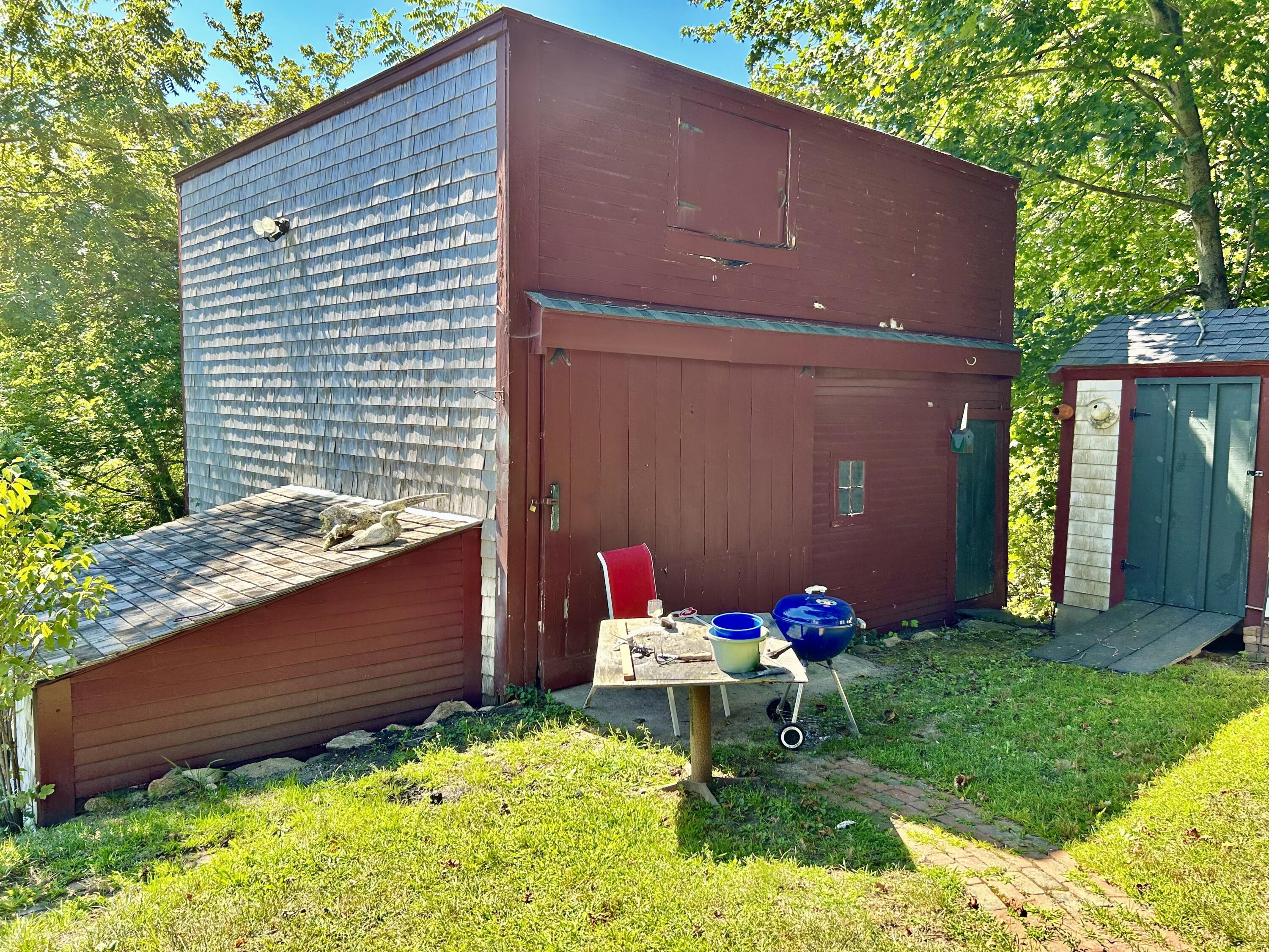 1580 Main Street Brewster, MA 02631 - Photo 14 of 20 a backyard of a house with table and chairs