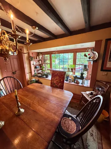 a bed sitting in a room next to a window