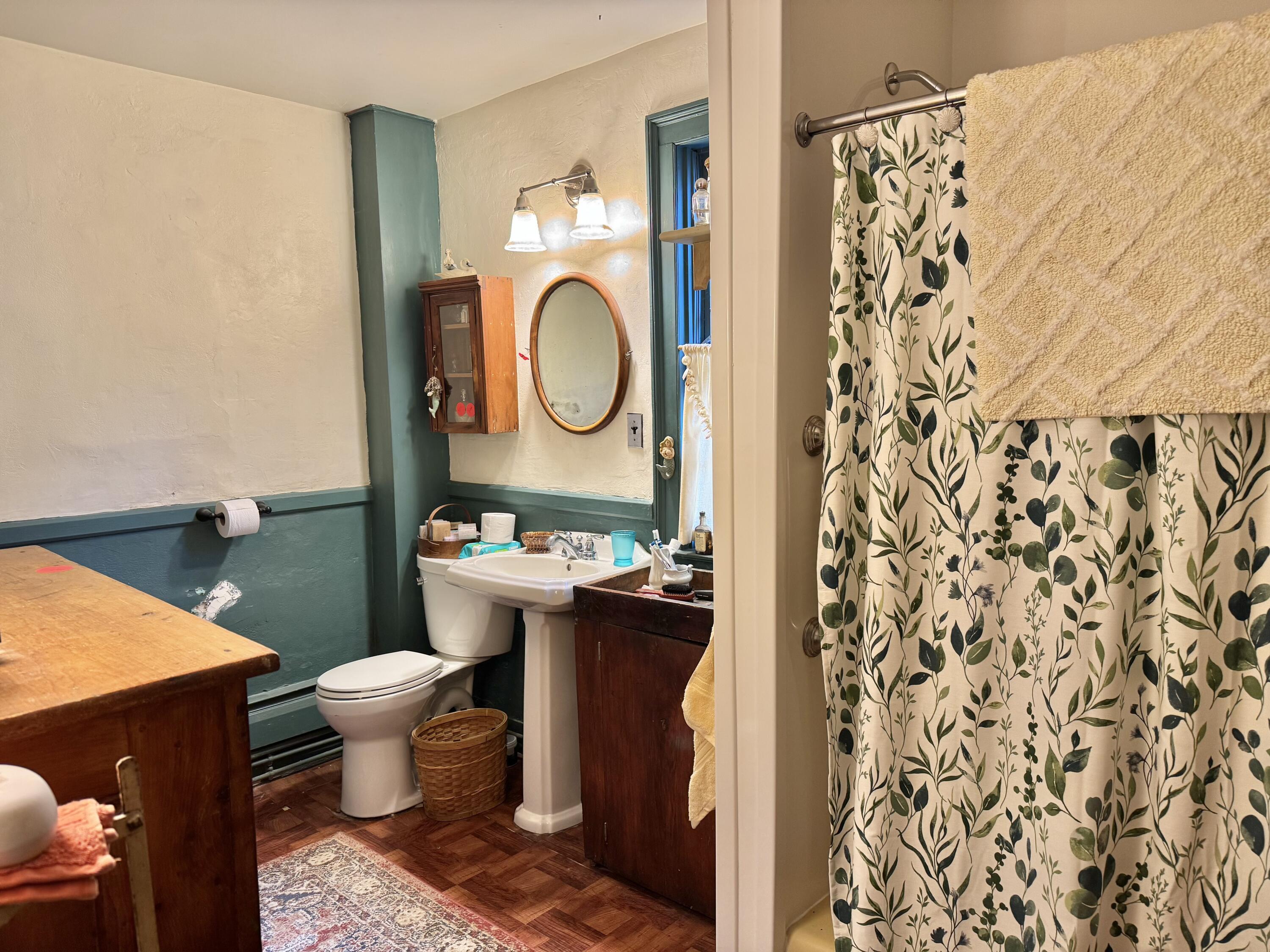 1580 Main Street Brewster, MA 02631 - Photo 8 of 20 a bathroom with a toilet and a shower curtain