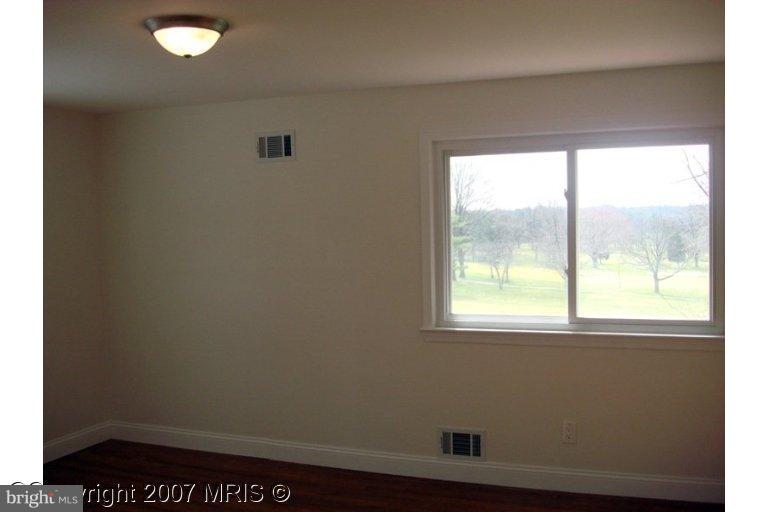 304 Old Courthouse Road Northeast Vienna, VA 22180 - Photo 8 of 20 an empty room with a window