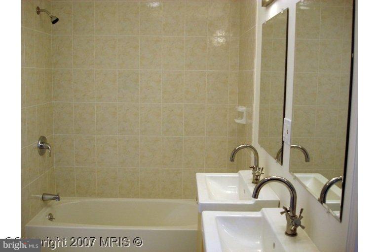 304 Old Courthouse Road Northeast Vienna, VA 22180 - Photo 9 of 20 a bathroom with a shower
