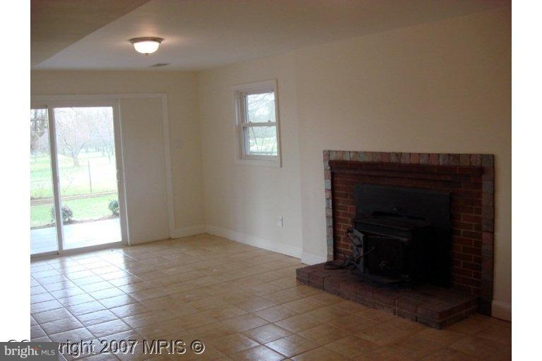 304 Old Courthouse Road Northeast Vienna, VA 22180 - Photo 10 of 20 a living room with a fireplace