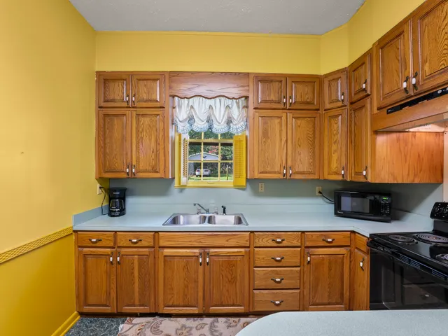 a kitchen with a sink and a refrigerator
