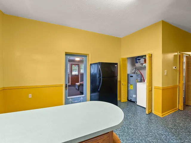 a view of a livingroom with furniture and an empty room