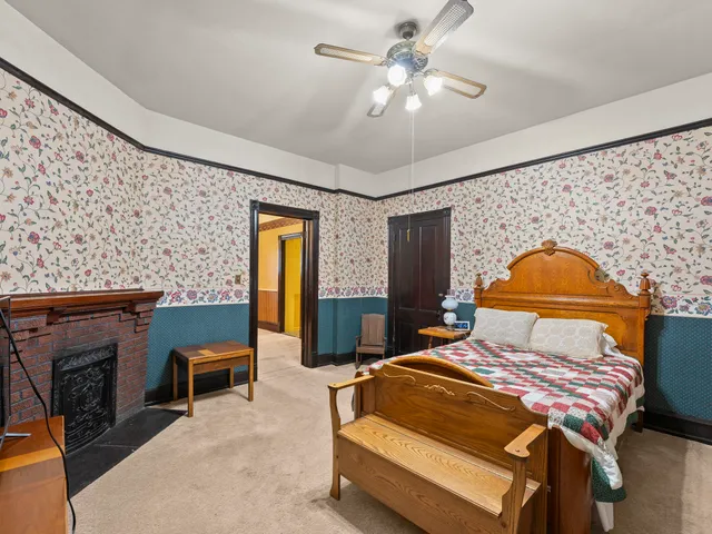 a bedroom with a bed and a television