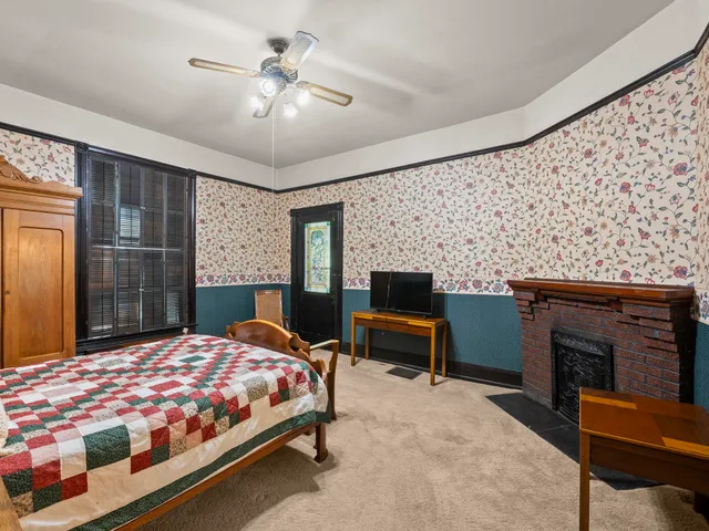 a view of a hallway with wooden floor and entryway