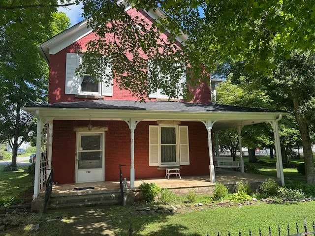 front view of a house with a yard