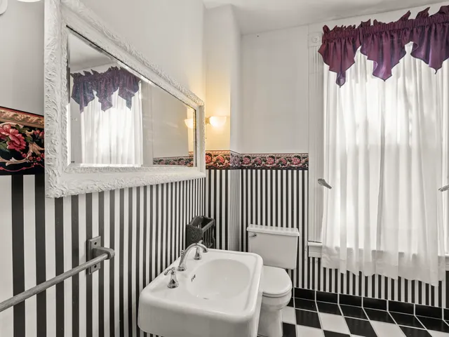 a bathroom with a bathtub and shower