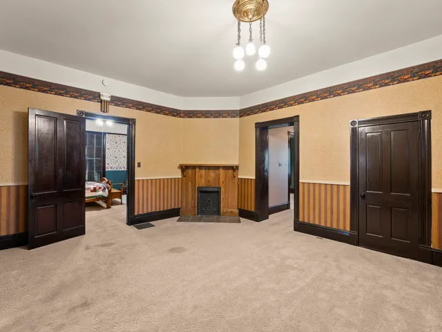 a bedroom with furniture and a fireplace