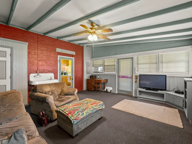 a kitchen with stainless steel appliances granite countertop a sink dishwasher stove and cabinets