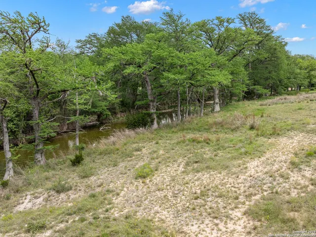 a living room with a couch a fireplace and a fireplace
