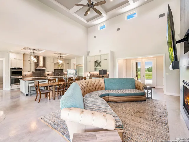 a kitchen with stainless steel appliances granite countertop a stove oven and a white cabinets