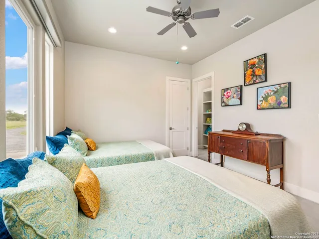 a bathroom with a glass shower door