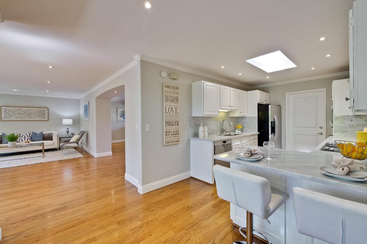 1875 Appletree Lane Mountain View, CA 94040 - Photo 13 of 39 a view of kitchen with kitchen island refrigerator stove microwave and cabinets