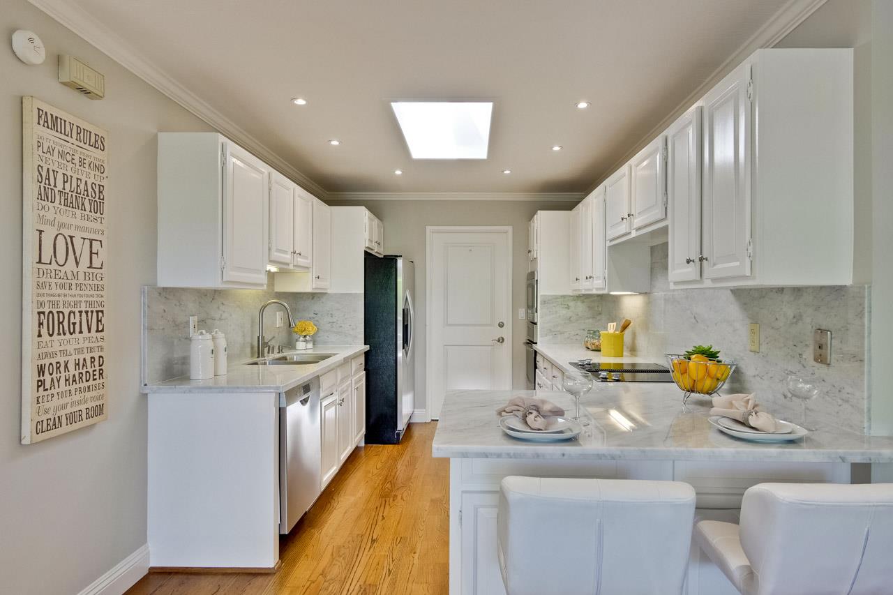 1875 Appletree Lane Mountain View, CA 94040 - Photo 15 of 39 a kitchen with stainless steel appliances granite countertop a sink a stove and a refrigerator