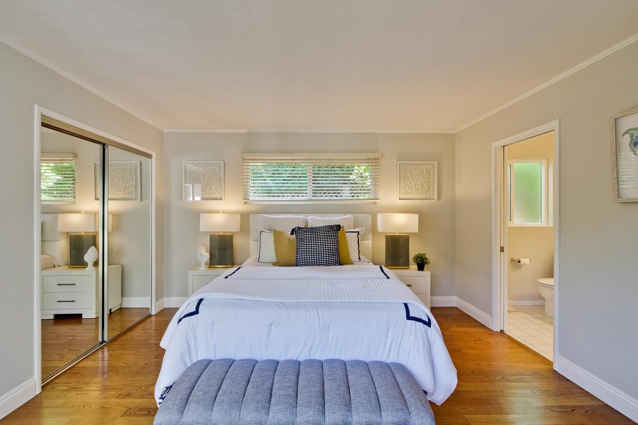 1875 Appletree Lane Mountain View, CA 94040 - Photo 22 of 39 a spacious bedroom with a bed and wooden floor