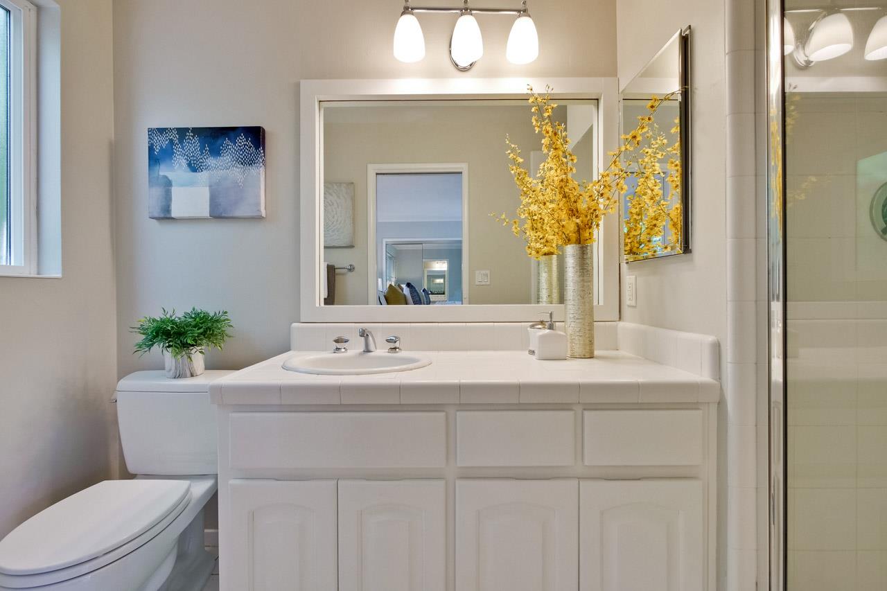 1875 Appletree Lane Mountain View, CA 94040 - Photo 23 of 39 a bathroom with a toilet a sink and mirror
