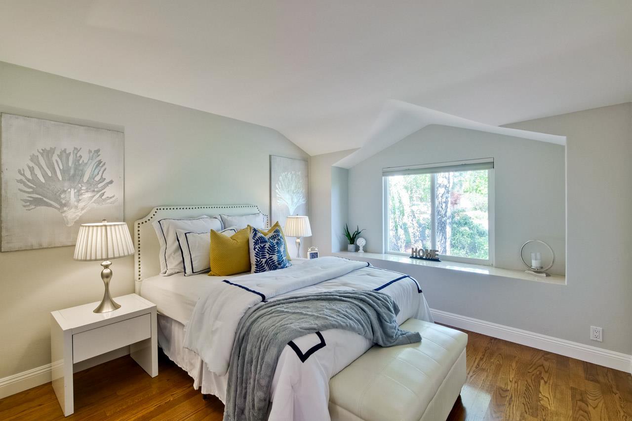 1875 Appletree Lane Mountain View, CA 94040 - Photo 25 of 39 a bedroom with a bed and a lamp