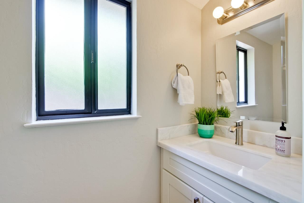 1875 Appletree Lane Mountain View, CA 94040 - Photo 32 of 39 a bathroom with a sink a mirror and a window
