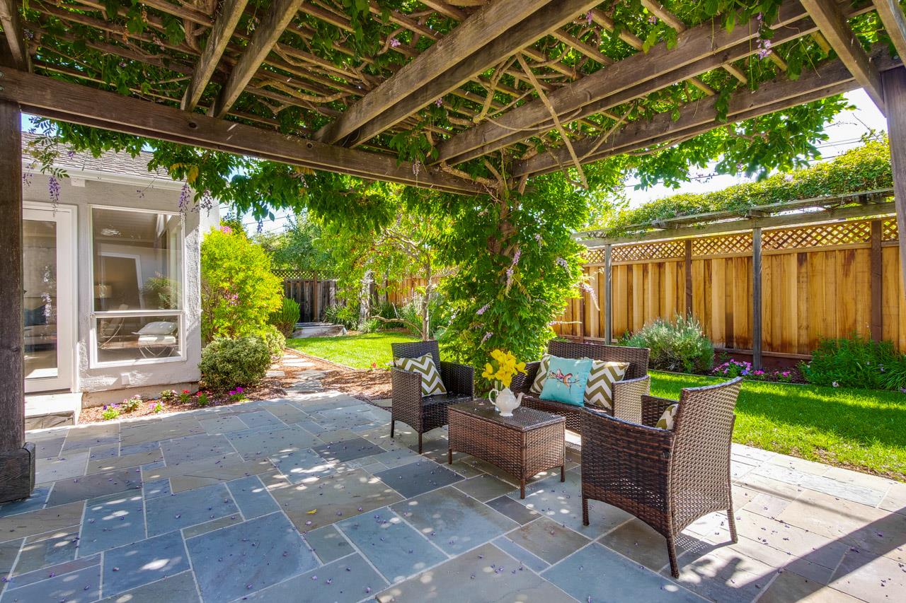 1875 Appletree Lane Mountain View, CA 94040 - Photo 36 of 39 a view of a patio with table and chairs potted plants and floor to ceiling window