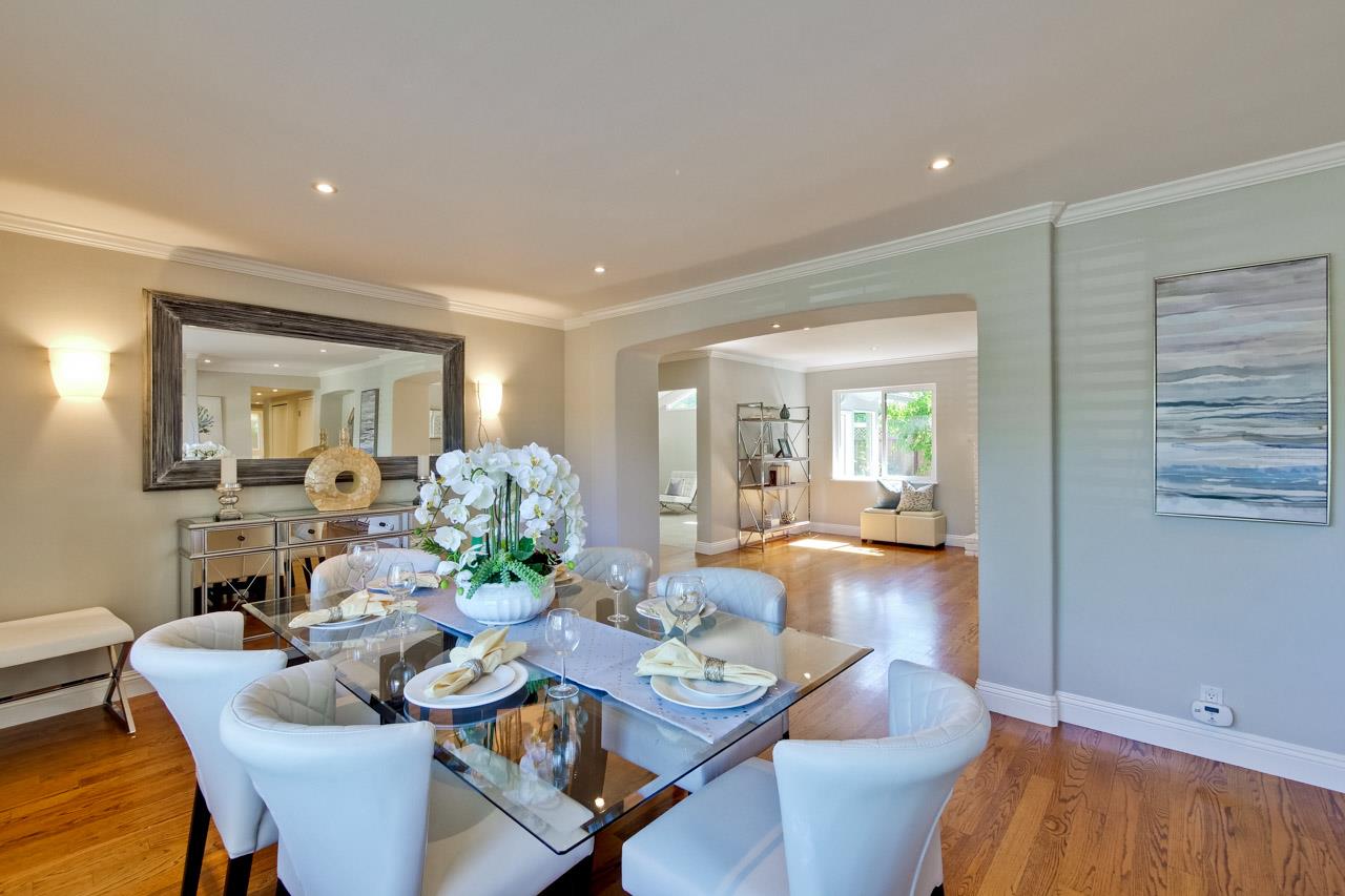 1875 Appletree Lane Mountain View, CA 94040 - Photo 7 of 39 a view of a dining room and livingroom with furniture wooden floor a rug and a chandelier