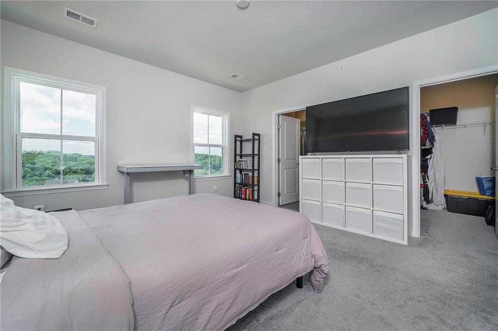 157 Cole Drive McKees Rocks, PA 15136 - Photo 19 of 25 Owners suite is sprawling with walk in closet and private bathroom. Wonderful views of the hills