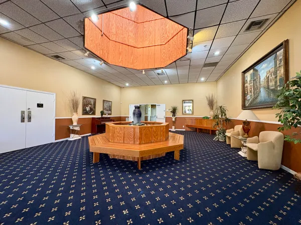 a living room with furniture a table and chairs