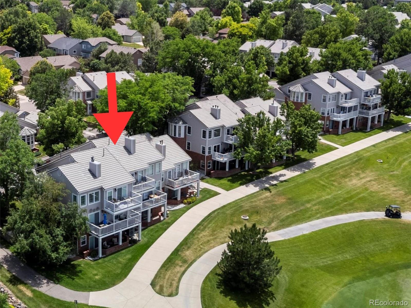 9323 Notts Court Lone Tree, CO 80124 - Photo 1 of 45 an aerial view of a house with a garden and swimming pool