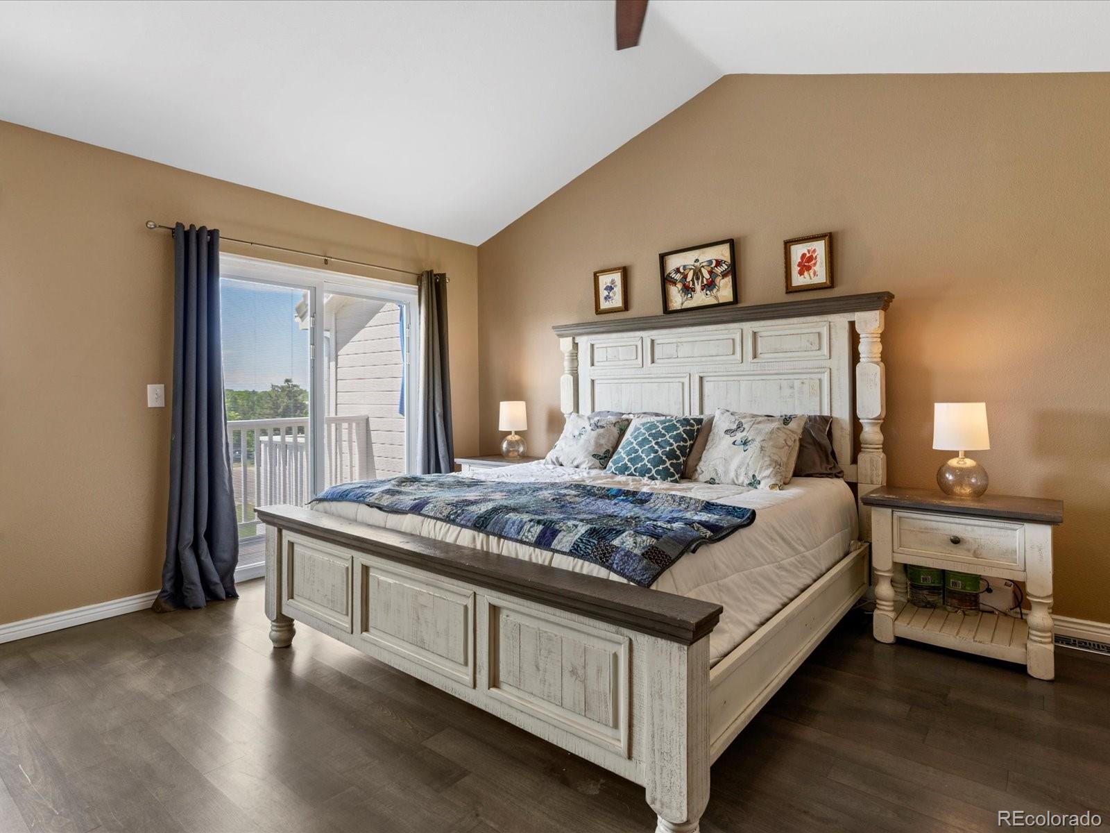 9323 Notts Court Lone Tree, CO 80124 - Photo 21 of 45 a bedroom with a bed and a large window