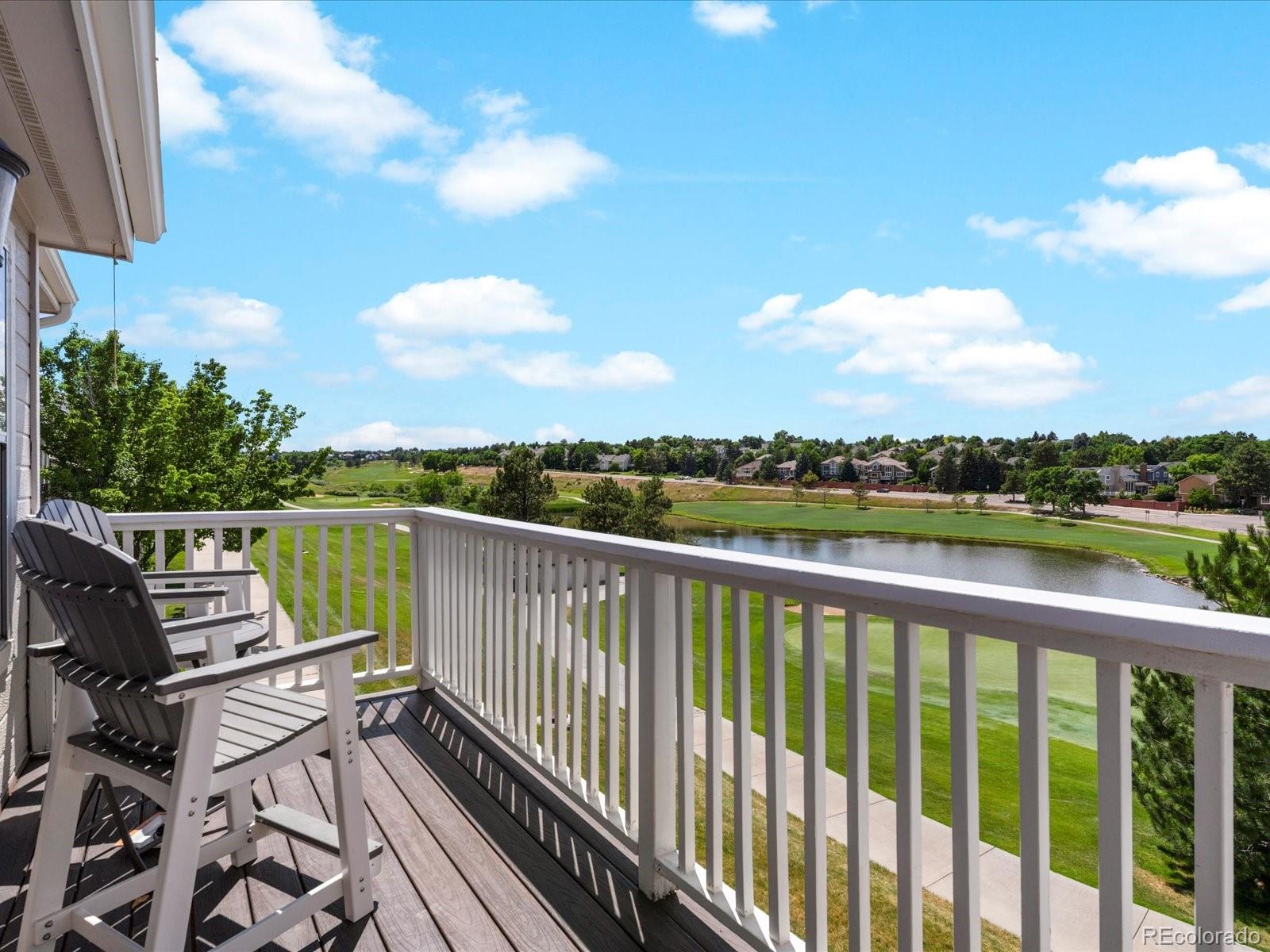 9323 Notts Court Lone Tree, CO 80124 - Photo 27 of 45 a balcony with wooden floor view and lake view