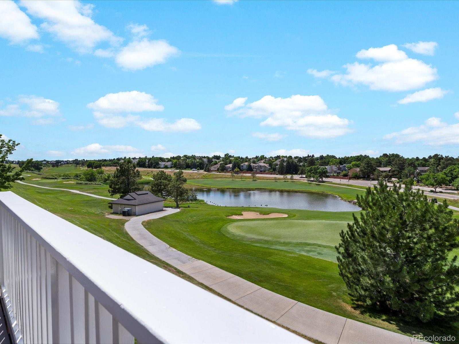9323 Notts Court Lone Tree, CO 80124 - Photo 28 of 45 a view of a lake with a big yard