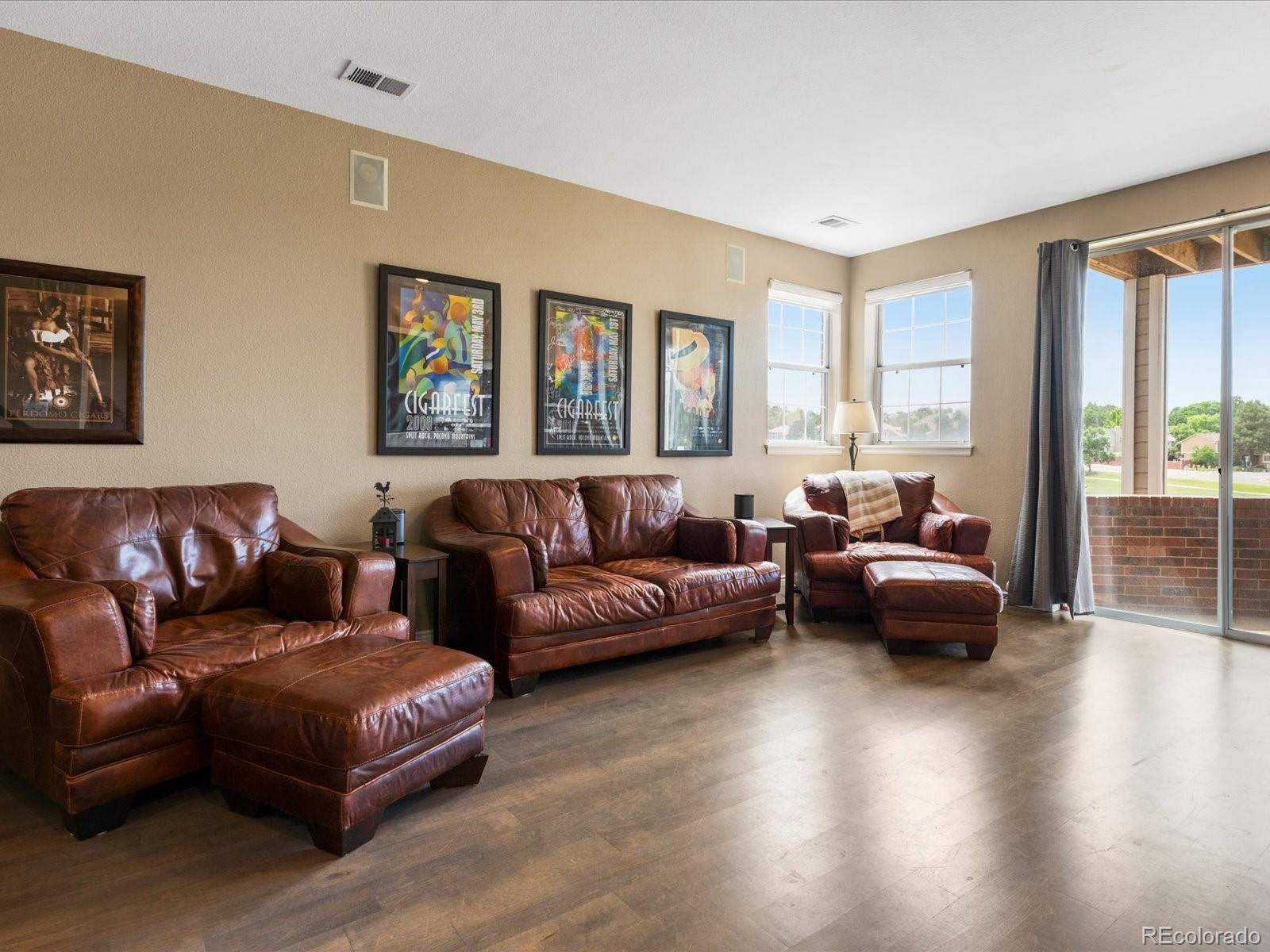 9323 Notts Court Lone Tree, CO 80124 - Photo 32 of 45 a living room with furniture and a large window